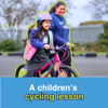 Virtual Gift A Children's Cycling Lesson: Image shows a young girl joyfully taking her first pedals in a playground, with a Sustrans Schools Officer