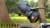 Restrap 14 litre saddle bag, mounted on a bicycle on a woodland trail.