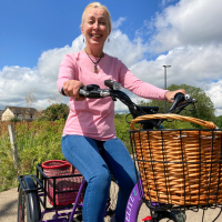 Sustrans volunteer with cerebral palsy using her etrike in Belfast.