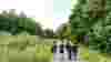 Group of young people walking along a traffic-free path