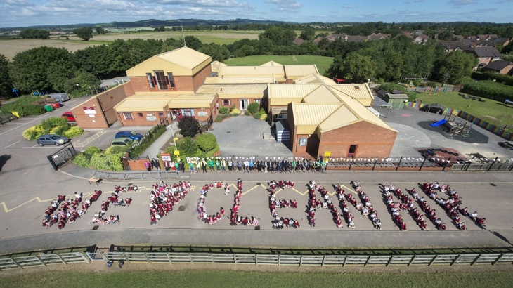 An Aerial Shot Of Pupils Spelling Out 'We Love Clean Air