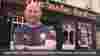 Video thumbnail of a man talking to camera in front of the pub he owns called 'The Bank Bar'.